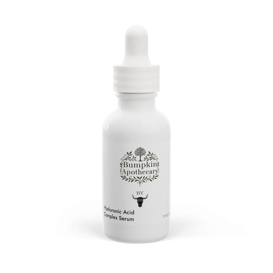 White serum bottle with dropper labeled 'Bumpkin Apothecary' on a white background