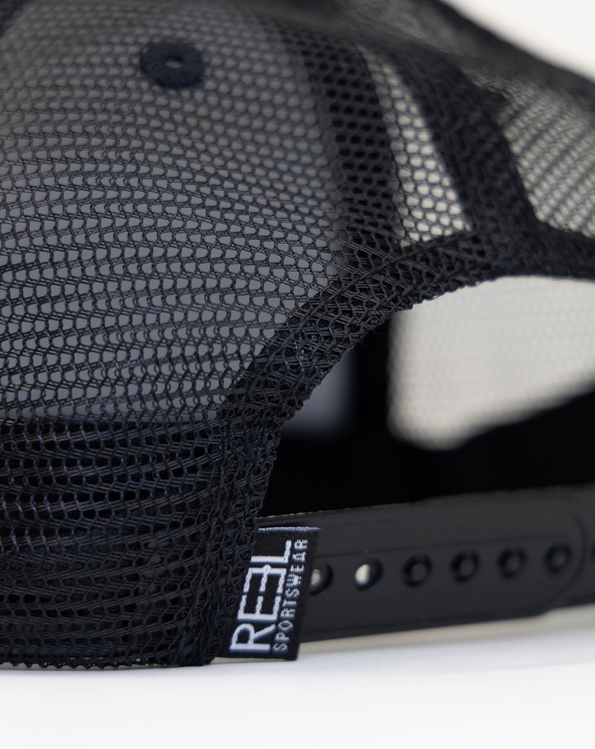Reel Sportswear Outcast X Black Trucker Hat