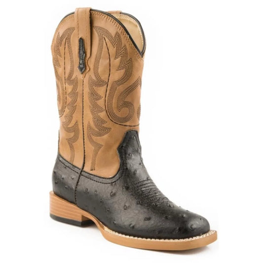 Cowboy boot with tan top and black bottom on a white background