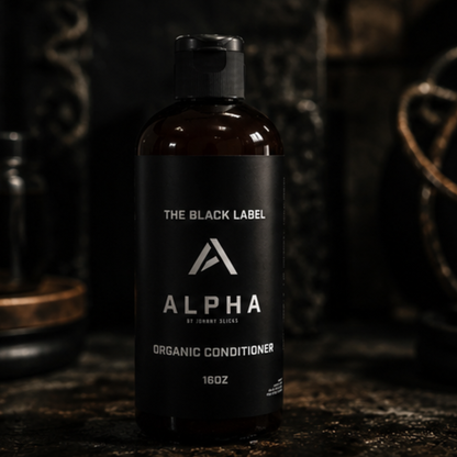 Alpha Organic Conditioner bottle with black label on a dark background