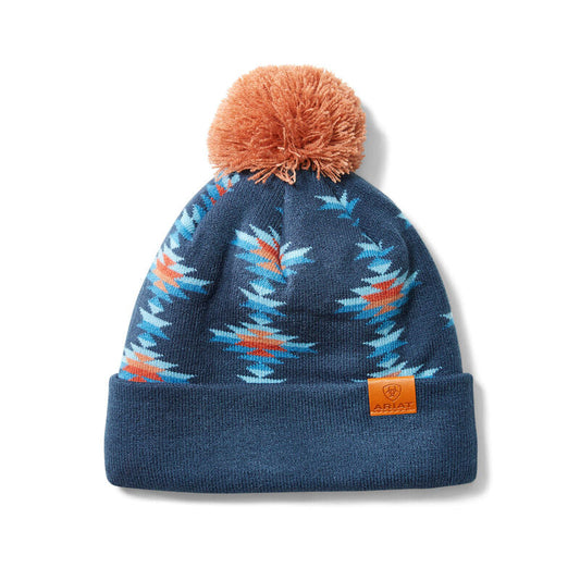 Blue beanie with colorful pattern and orange pom-pom on a white background