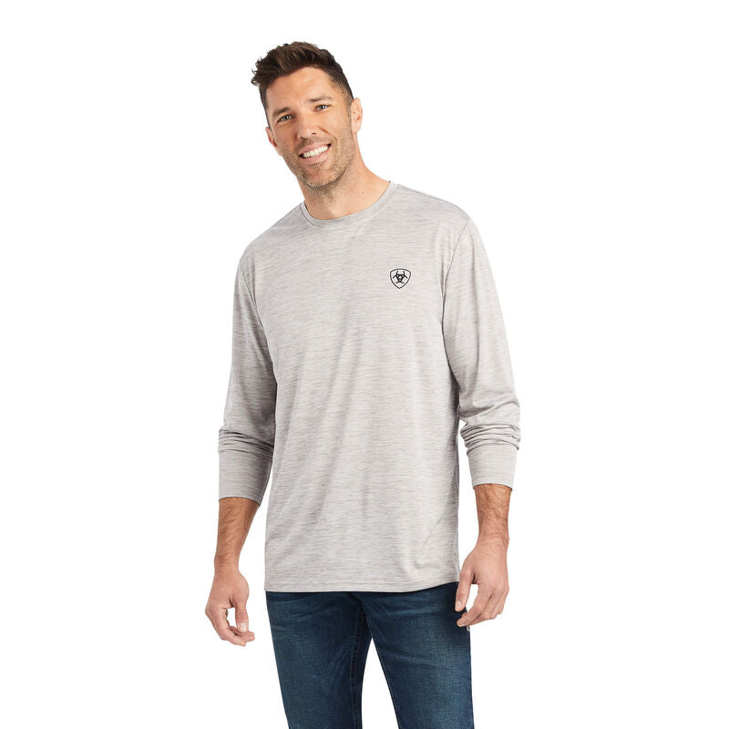 Man wearing a gray long-sleeve shirt with a logo on a white background