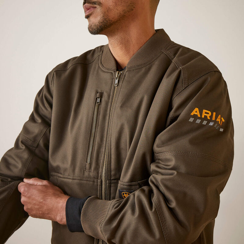 Brown jacket with ARIAT logo on sleeve against a neutral background
