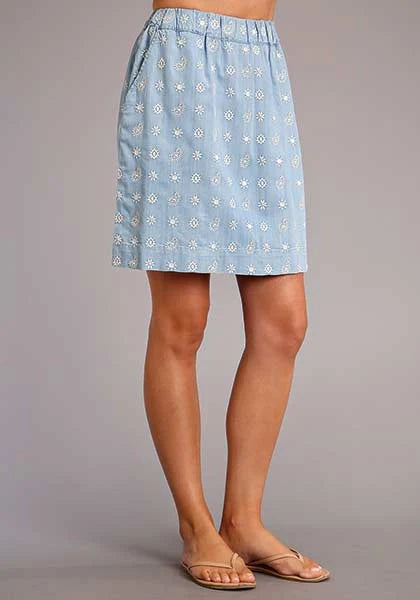 Light blue patterned skirt worn by a person on a gray background
