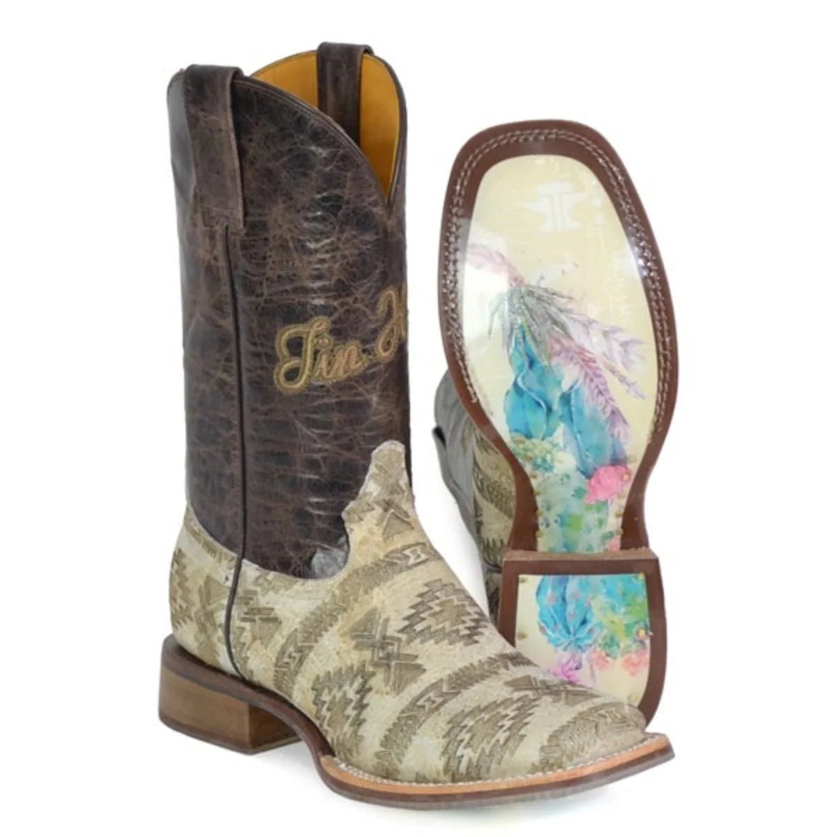 Brown cowboy boot with floral patterned sole on a white background