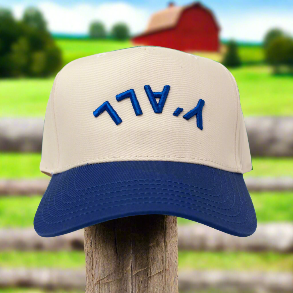 Beige and blue cap with 'Y'ALL' text on a white background