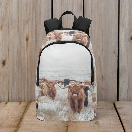 Backpack with highland cow design on a white background