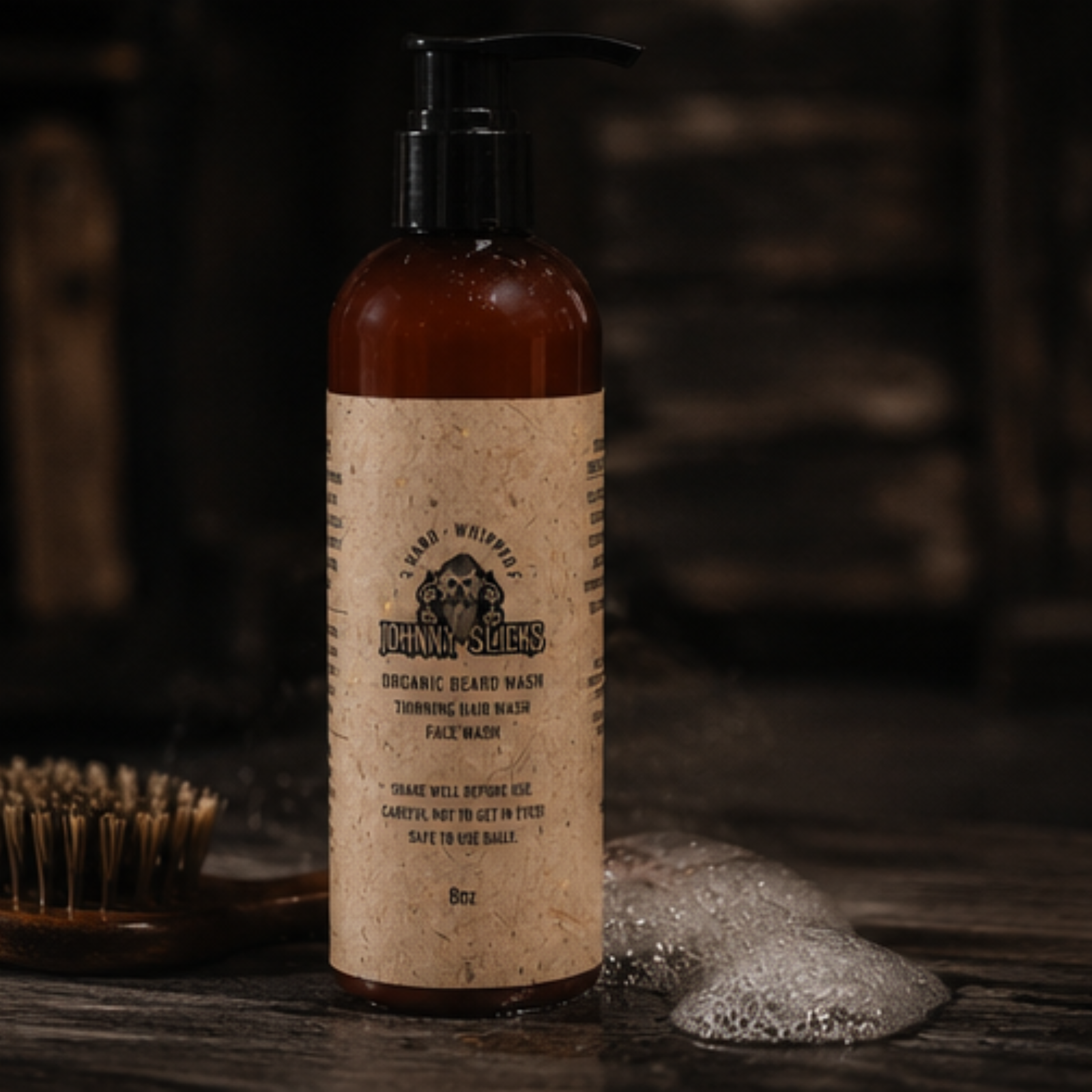 Bottle of Johnny Slicks organic beard wash with a brush and soap on a wooden surface.