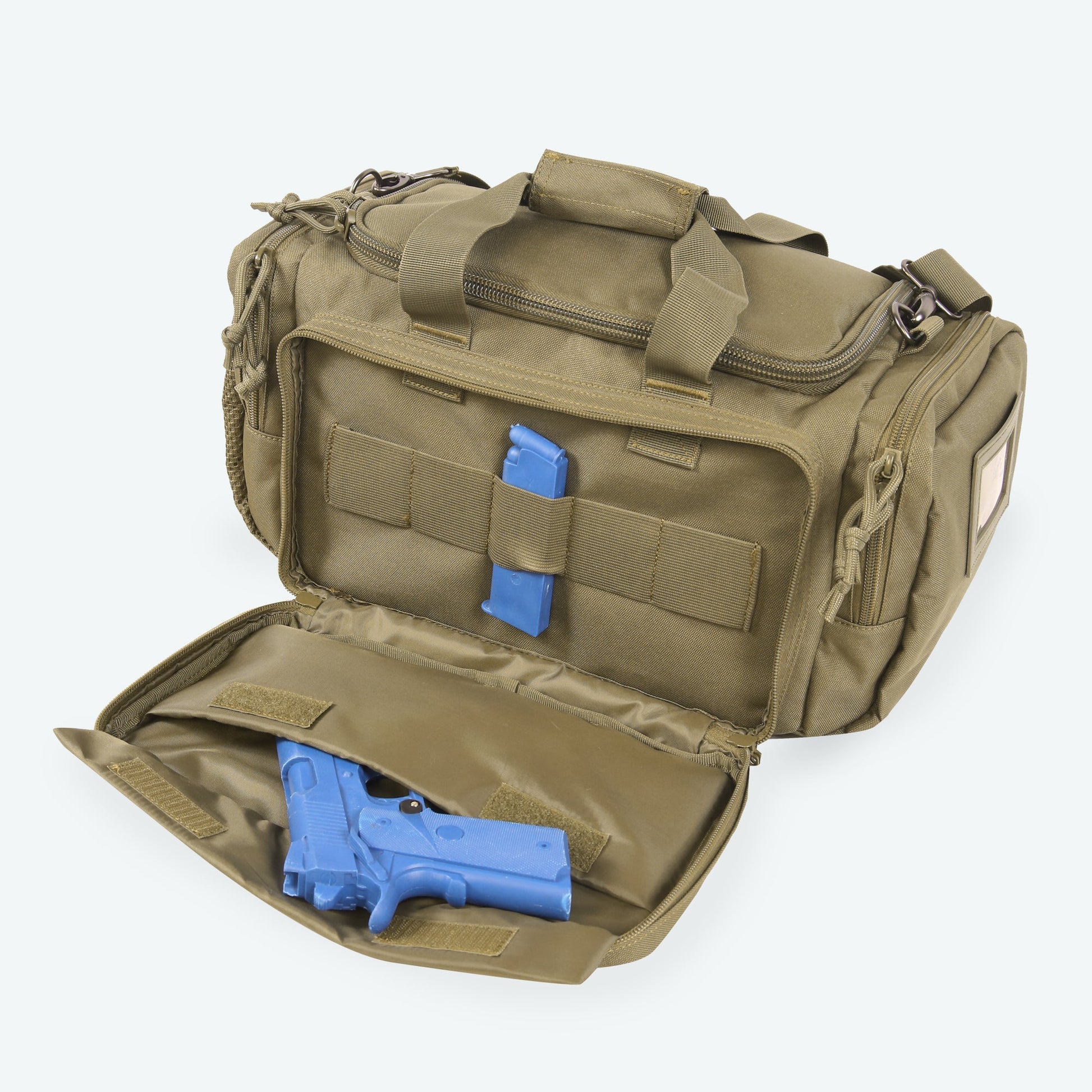 Open tactical bag with blue gun and magazine on a white background