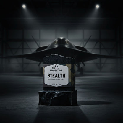 Bar of soap labeled 'Stealth' in front of a fighter jet in a hangar.