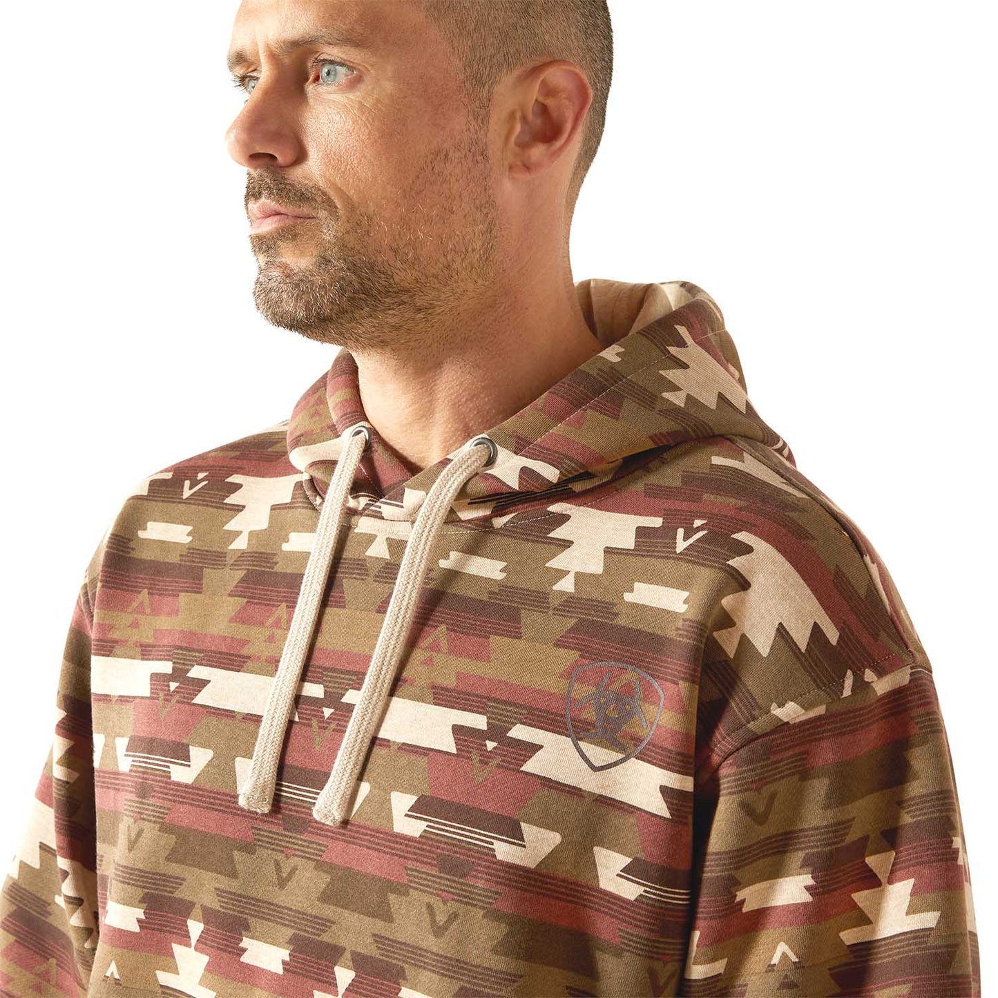 Man wearing a Aztec patterned Ariat hoodie on a white background featuring tribal print and lined sweatshirt 