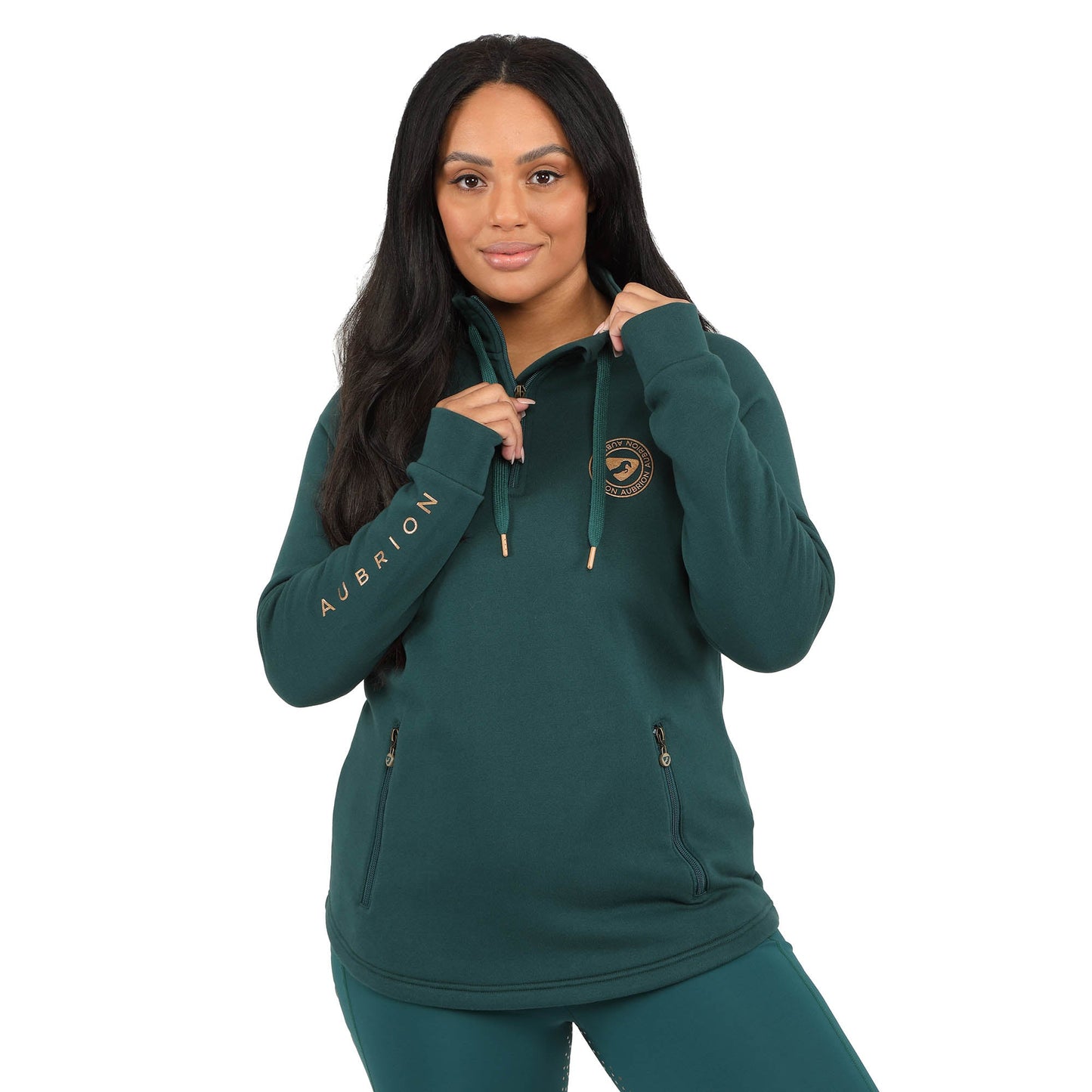 Woman wearing a green hoodie with 'Aubrikan' branding on a white background