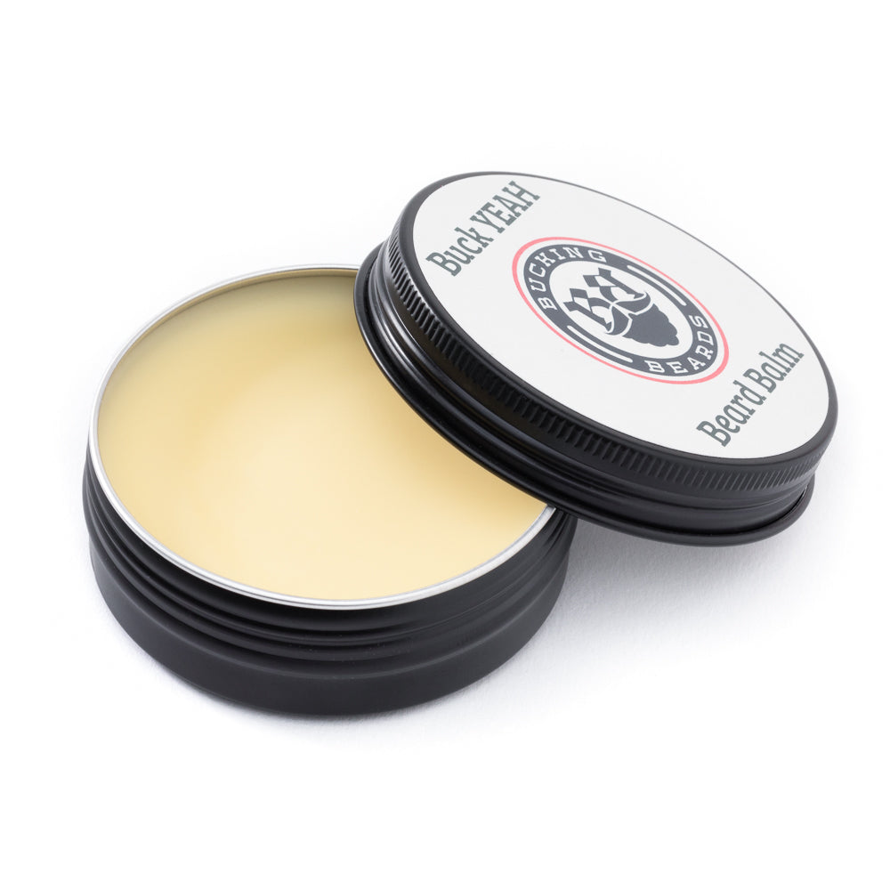 Beard balm container with open lid on a white background