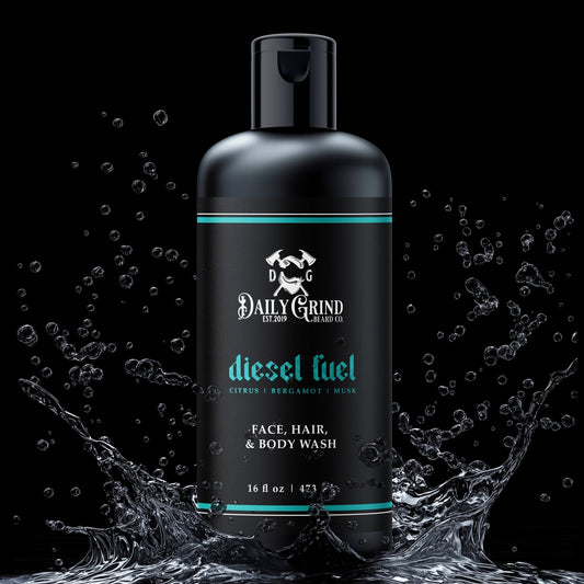 Black bottle of Daily Grind diesel fuel face, hair, and body wash with water splashes on a black background