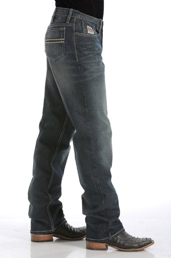 Blue jeans worn by a person on a white background