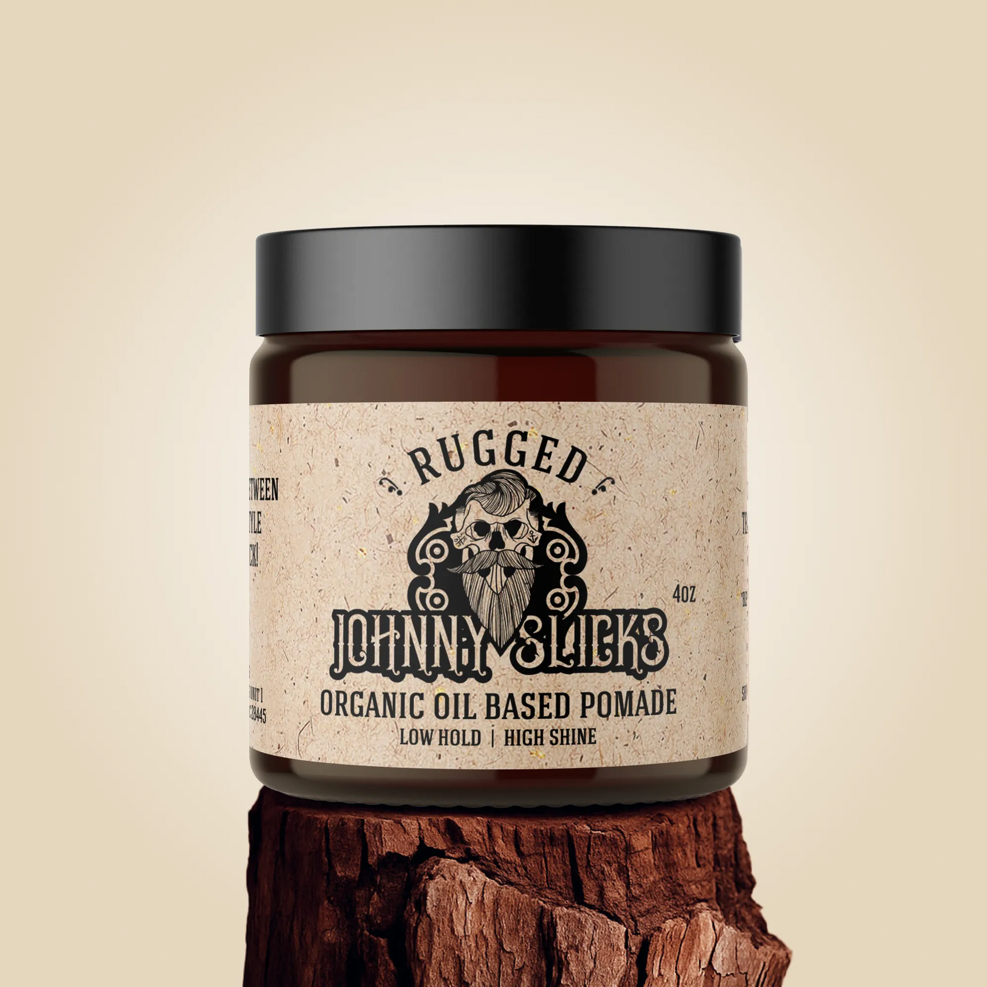 Jar of Rugged Johnny Slicks organic oil-based pomade on a beige background
