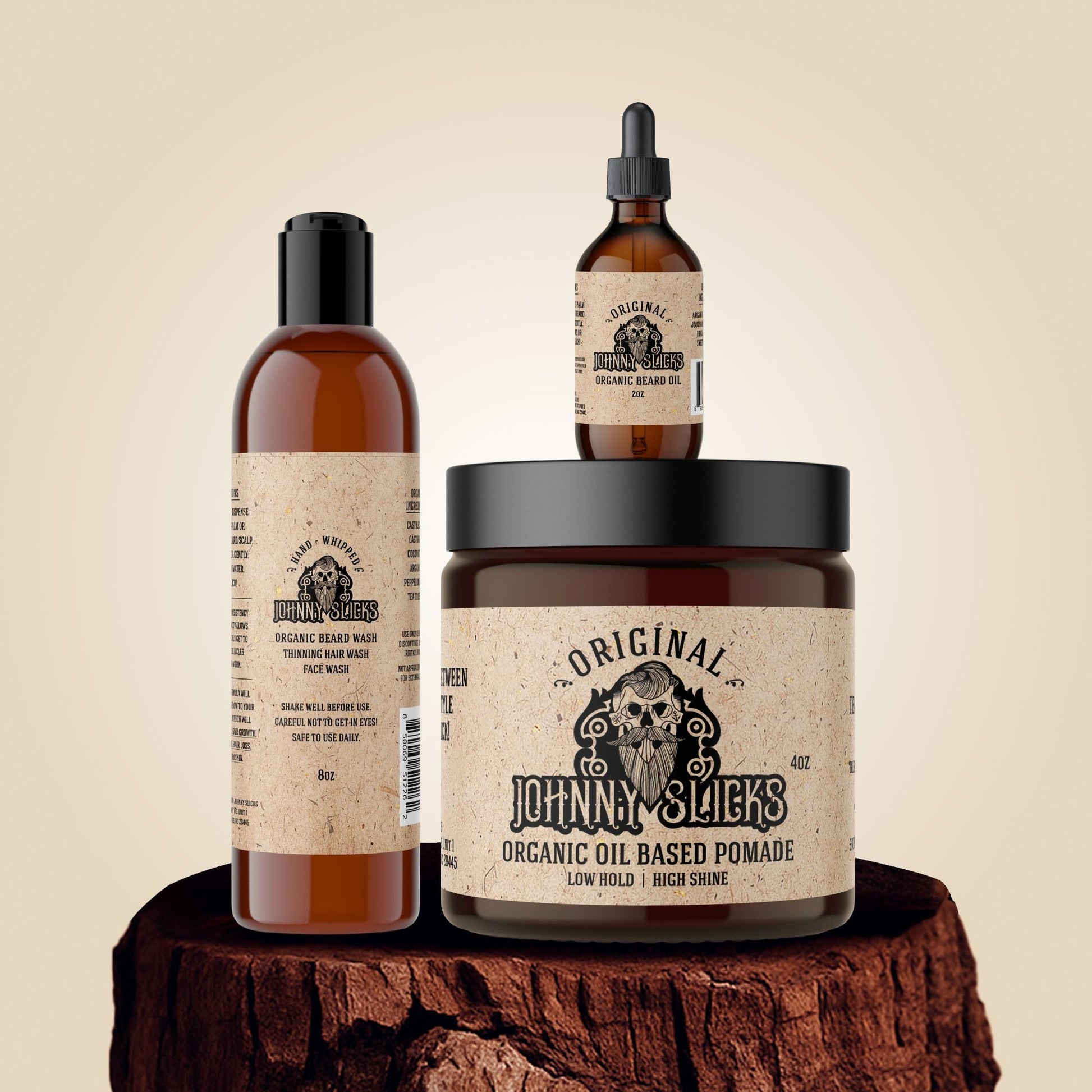 Three bottles of Johnny Slicks grooming products on a wooden block with a beige background.