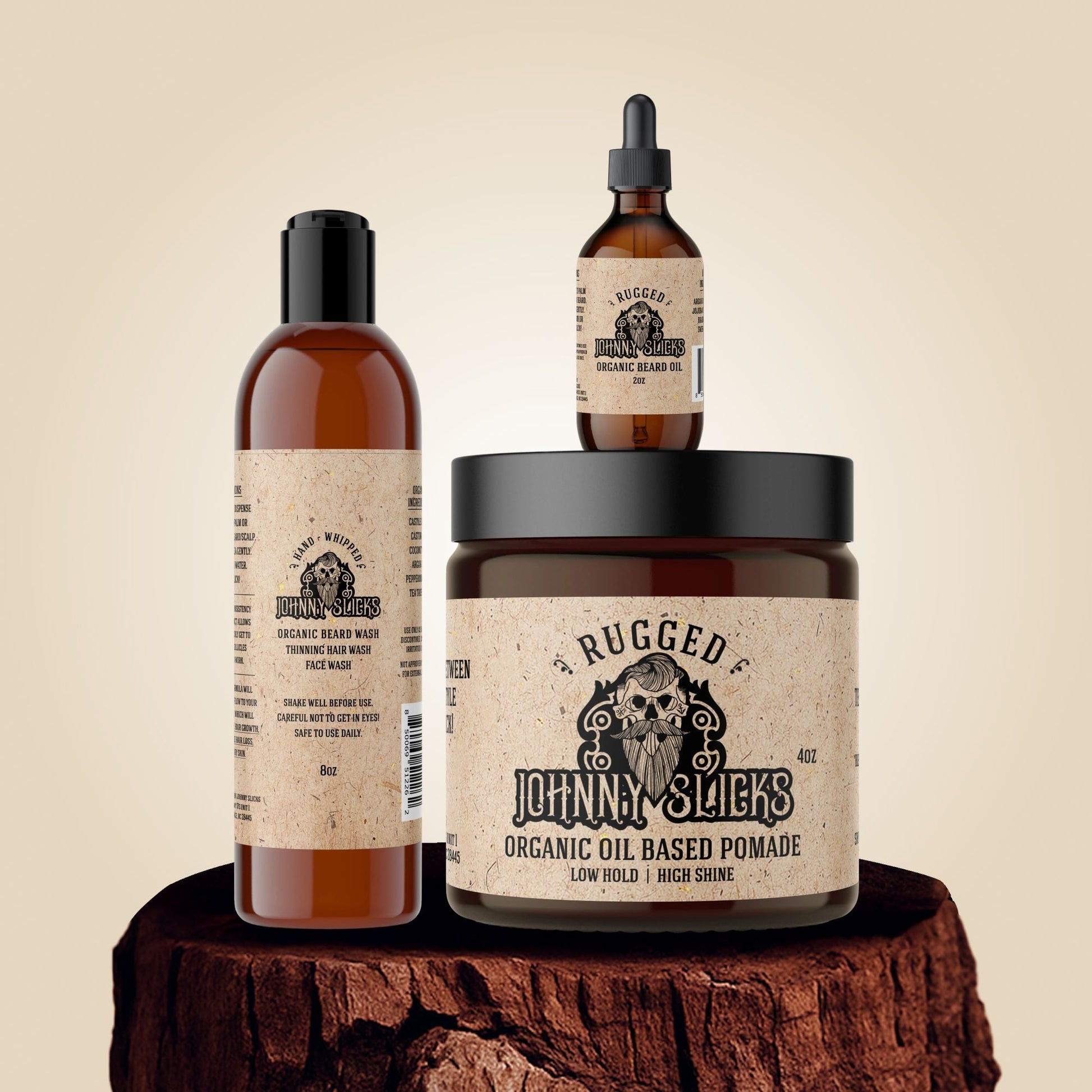Three bottles of Johnny Sticks grooming products on a wooden block with a beige background